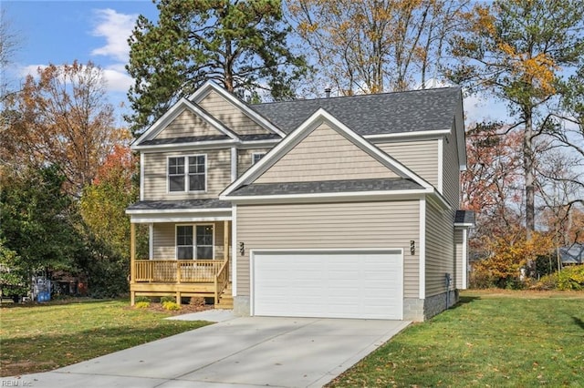 view of front facade featuring a garage, a front lawn, and covered porch