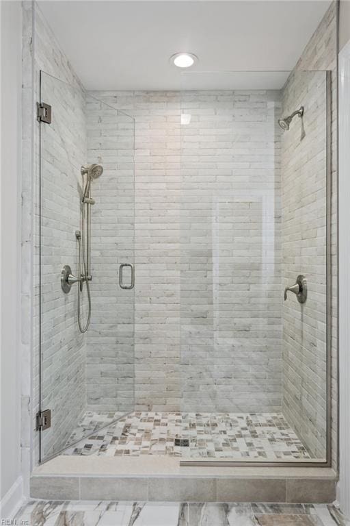 bathroom with a shower stall