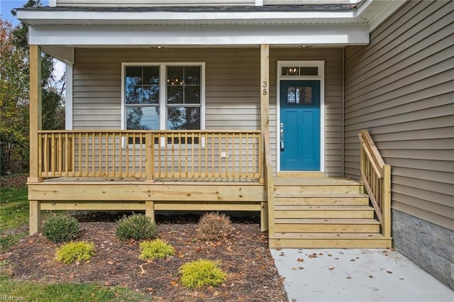 entrance to property featuring a porch