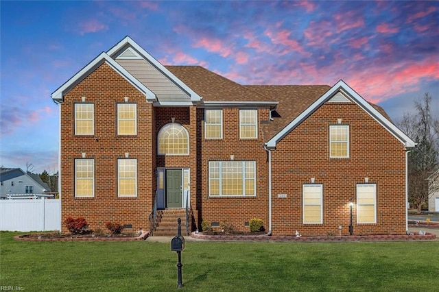 view of front of home featuring a lawn