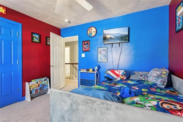 bedroom featuring ceiling fan and light colored carpet