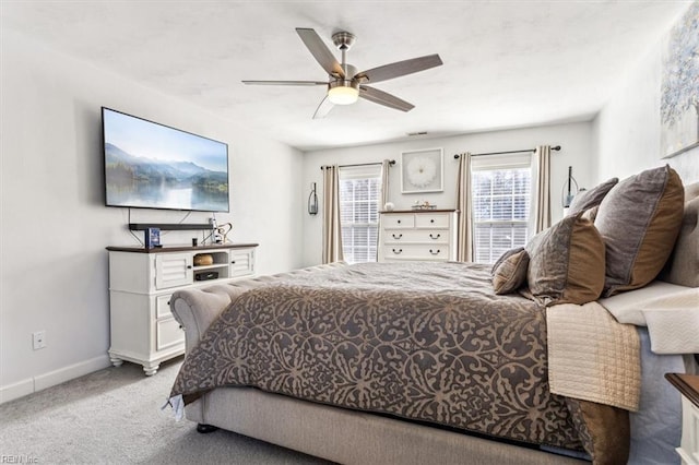 bedroom with ceiling fan and carpet flooring