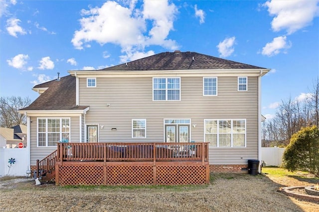 back of property featuring a yard and a deck