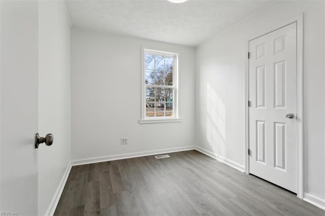 spare room featuring light hardwood / wood-style flooring