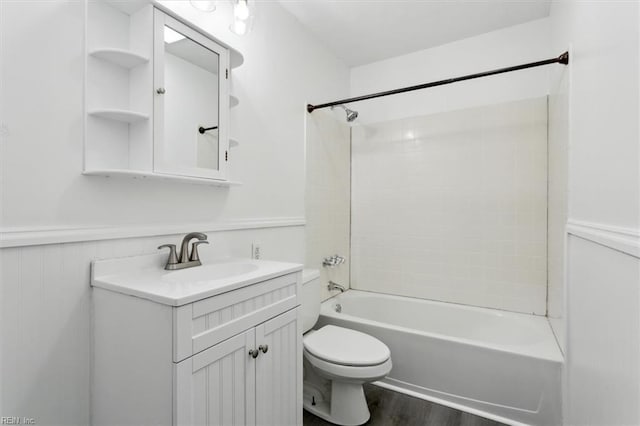 full bathroom with vanity, hardwood / wood-style flooring, shower / washtub combination, and toilet