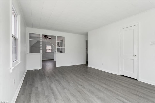 empty room featuring hardwood / wood-style floors and ceiling fan