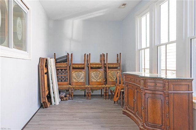 dining space with light hardwood / wood-style flooring