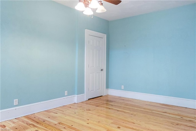 empty room with ceiling fan and light wood-type flooring