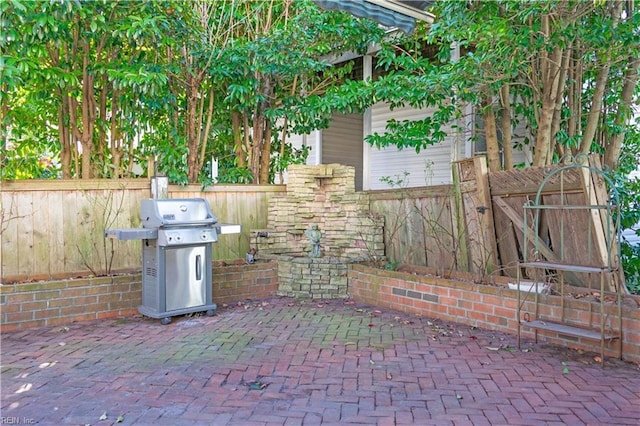 view of patio with a grill