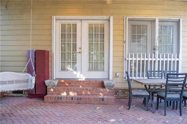 doorway to property featuring a patio area and french doors