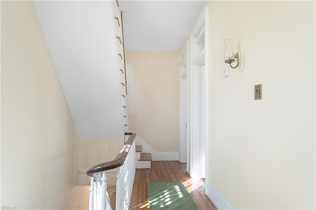 hallway with light hardwood / wood-style flooring