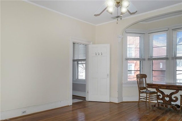 dining area featuring ornamental molding, dark hardwood / wood-style floors, and ceiling fan