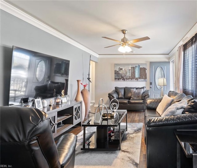 living room with crown molding, wood-type flooring, and ceiling fan