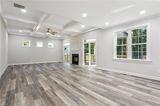 unfurnished living room featuring beam ceiling, coffered ceiling, ceiling fan, and light hardwood / wood-style floors