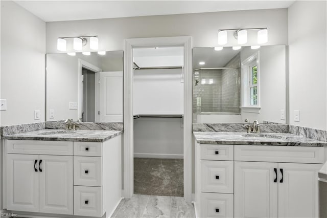 bathroom featuring vanity and walk in shower