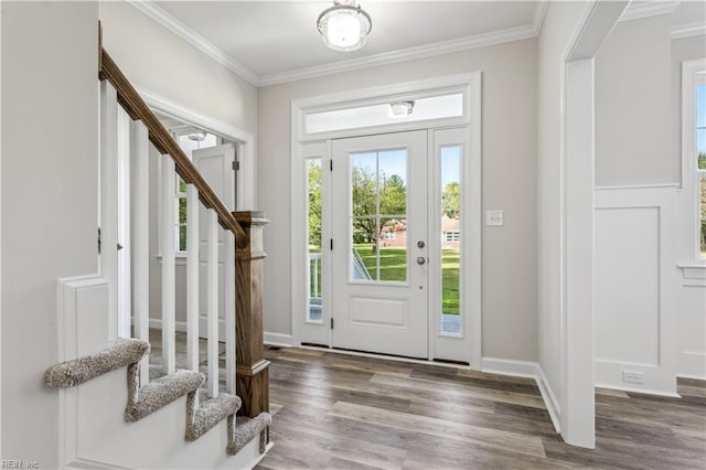 entryway featuring crown molding and dark hardwood / wood-style flooring