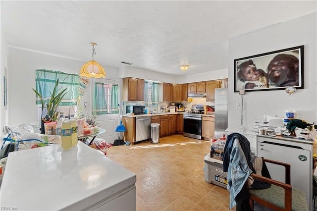 kitchen featuring pendant lighting and stainless steel appliances