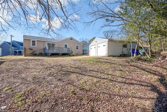 back of house featuring a wooden deck