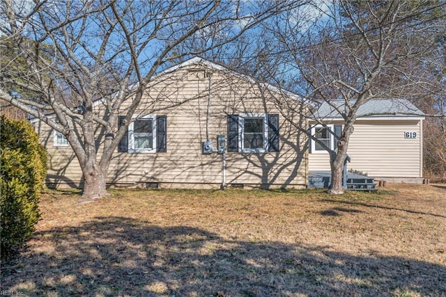 view of property exterior with a yard