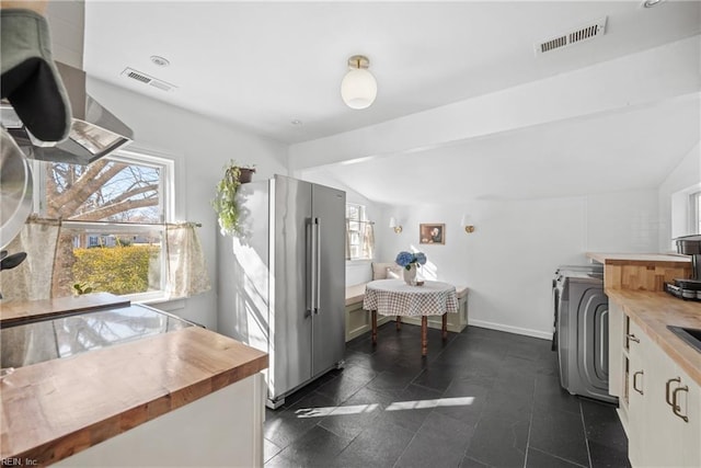 bathroom featuring lofted ceiling with beams