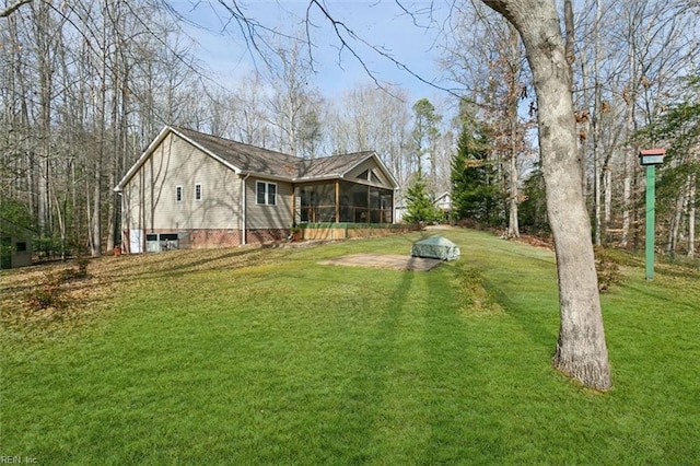 view of yard featuring a sunroom