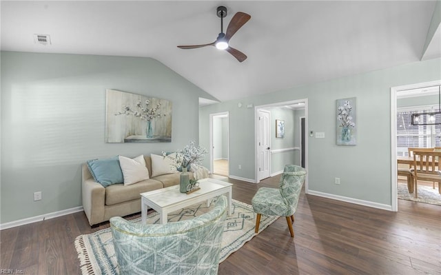 living room featuring ceiling fan, lofted ceiling, and dark hardwood / wood-style flooring