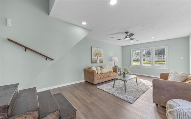 living room featuring ceiling fan and wood-type flooring