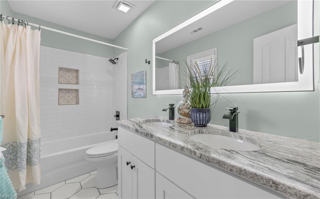 full bathroom featuring tile patterned floors, vanity, toilet, and shower / bath combo