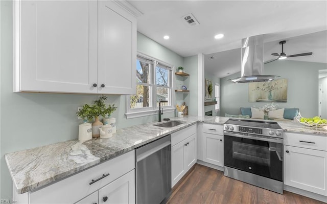 kitchen featuring appliances with stainless steel finishes, white cabinetry, sink, island exhaust hood, and kitchen peninsula