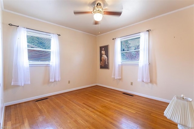 spare room featuring ornamental molding, ceiling fan, and light hardwood / wood-style flooring