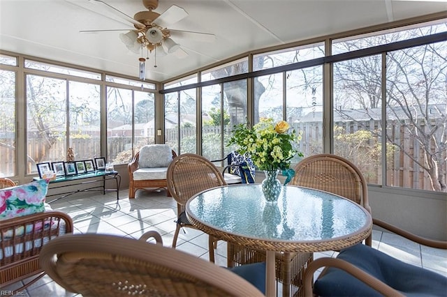 sunroom with ceiling fan and plenty of natural light