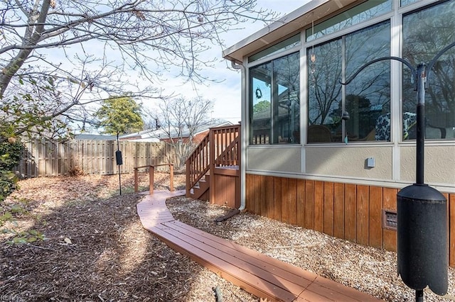 view of side of home featuring a sunroom