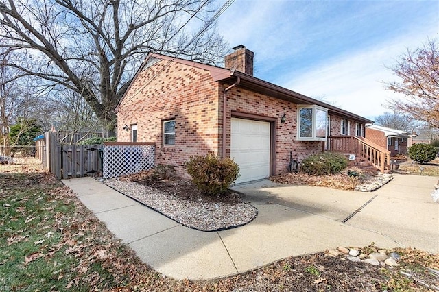 view of side of home with a garage