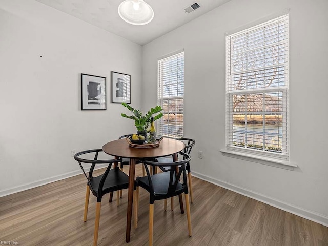 dining area featuring hardwood / wood-style floors