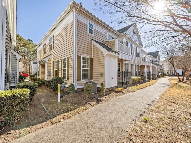 view of side of property with central AC unit