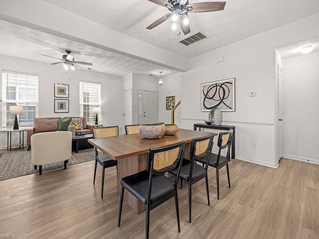 dining area featuring light hardwood / wood-style floors and ceiling fan