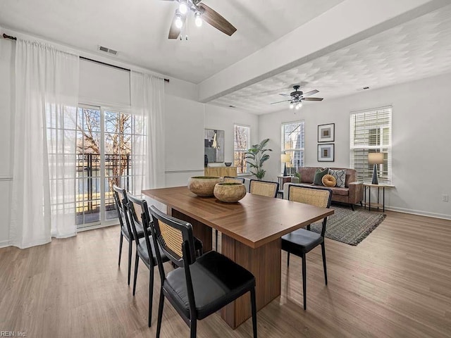 dining room featuring ceiling fan and light wood-type flooring