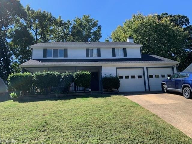 traditional-style home featuring driveway, covered porch, a chimney, a front lawn, and a garage