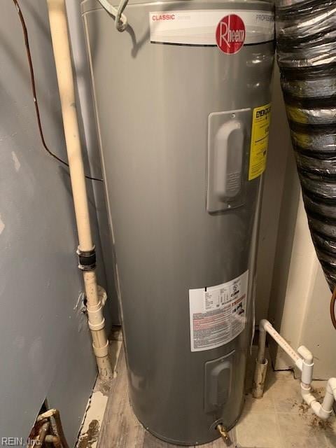 utility room with electric water heater