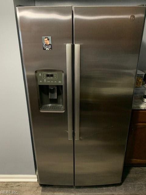 details featuring stainless steel refrigerator with ice dispenser