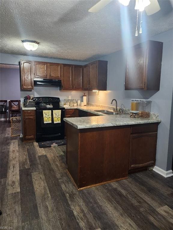 kitchen featuring dark hardwood / wood-style flooring, sink, black electric range, and kitchen peninsula