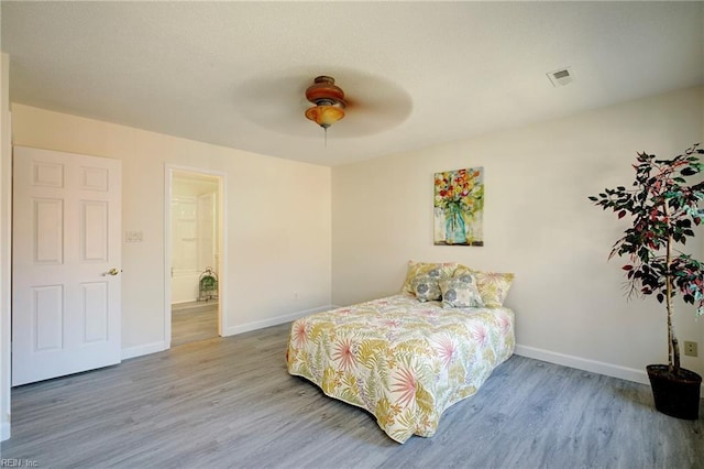 bedroom featuring hardwood / wood-style flooring and ceiling fan