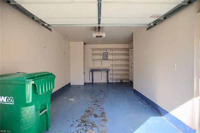 garage featuring a garage door opener and electric panel