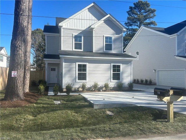 view of front of property with a garage and a front yard