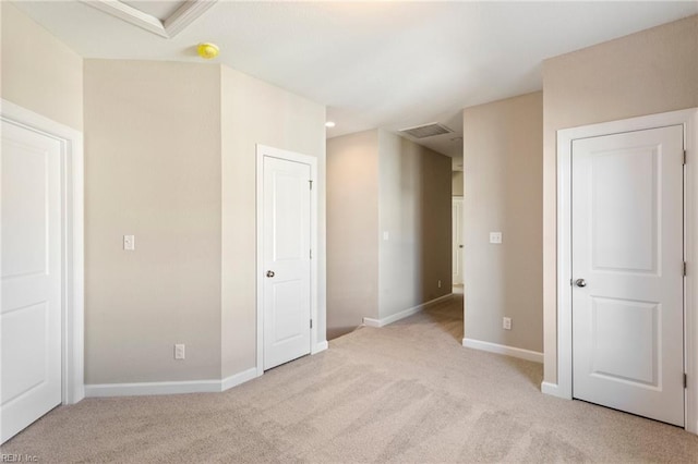 interior space featuring light colored carpet