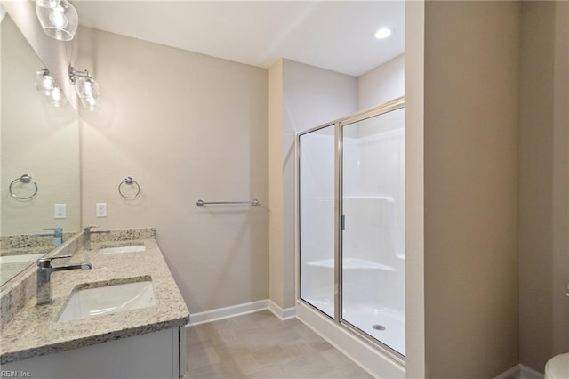 bathroom with an enclosed shower and vanity