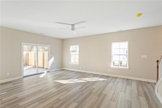 spare room featuring ceiling fan and light hardwood / wood-style flooring