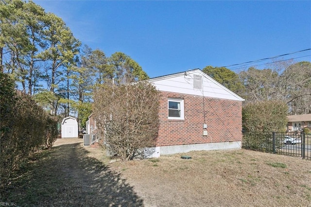 view of property exterior featuring a storage shed, central AC unit, and a yard