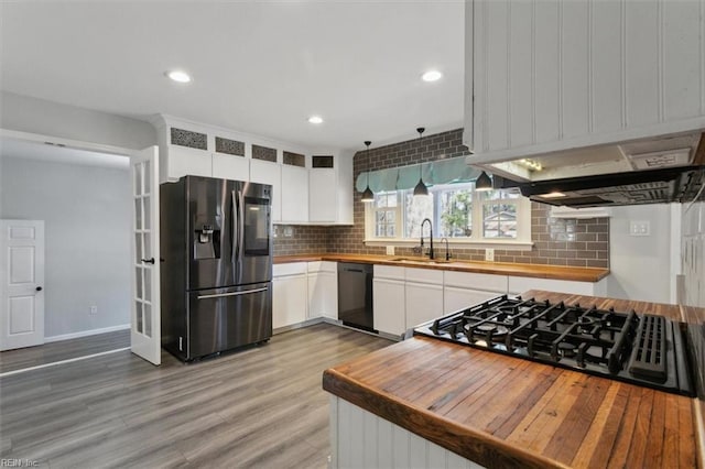 kitchen featuring white cabinetry, stainless steel fridge with ice dispenser, sink, and black dishwasher