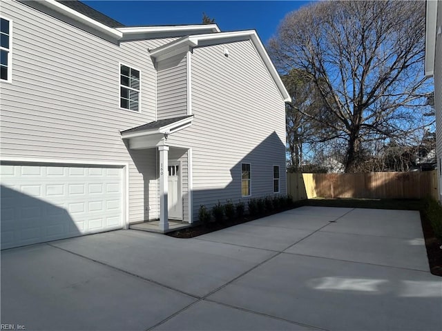 view of side of home featuring a garage